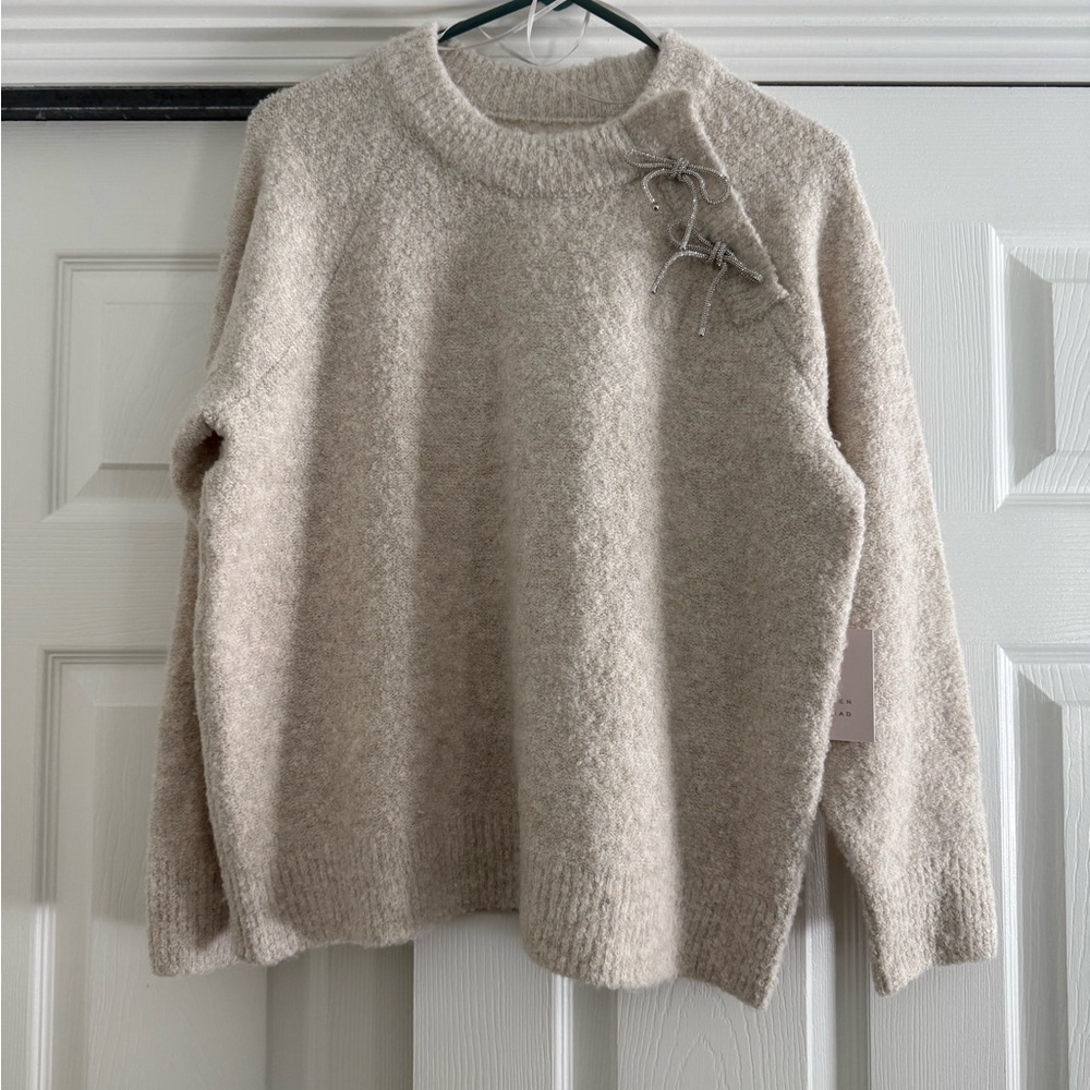 Cozy Beige Sweater with Bow Detail